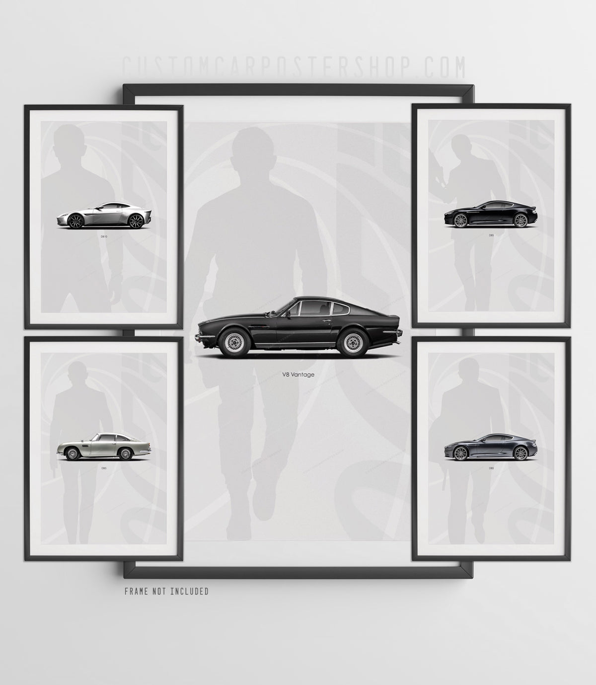 Five framed James Bond Aston Martin prints: the V8 Vantage centred, with the DB10, black DBS, DB5 and grey DBS around it