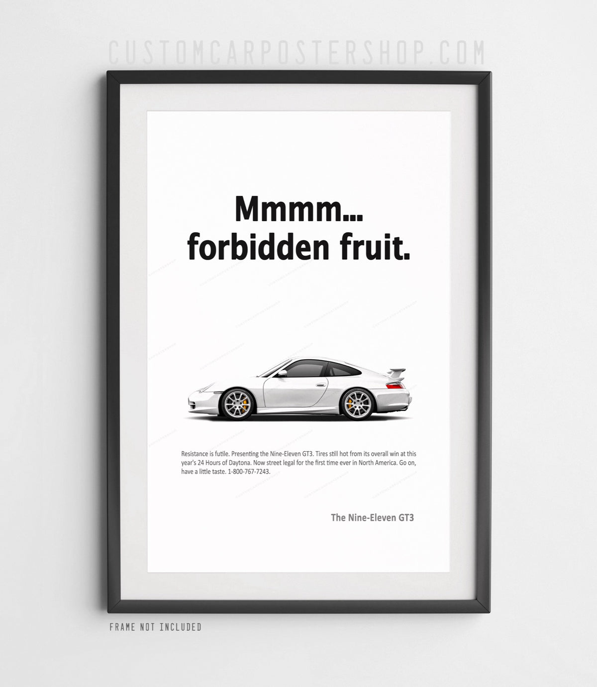 Porsche 996.2 911 GT3 in side profile with its iconic rear wing beneath “Mmmm... forbidden fruit.” typography on a minimalist remastered Porsche print ad.