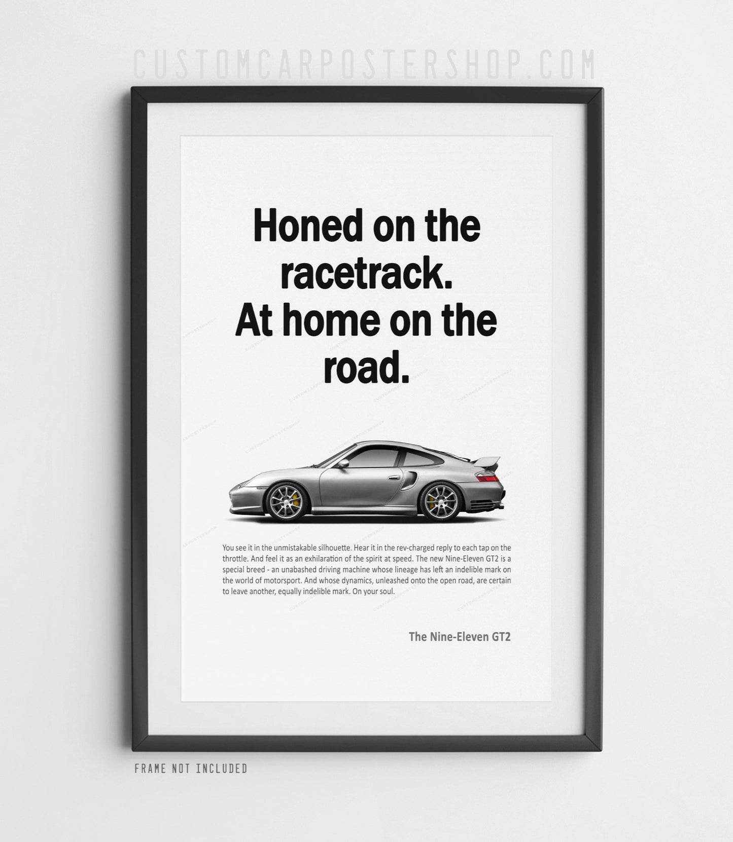 Porsche 996.2 GT2 remastered poster featuring a silver 911 GT2 with “Honed on the racetrack. At home on the road.” headline