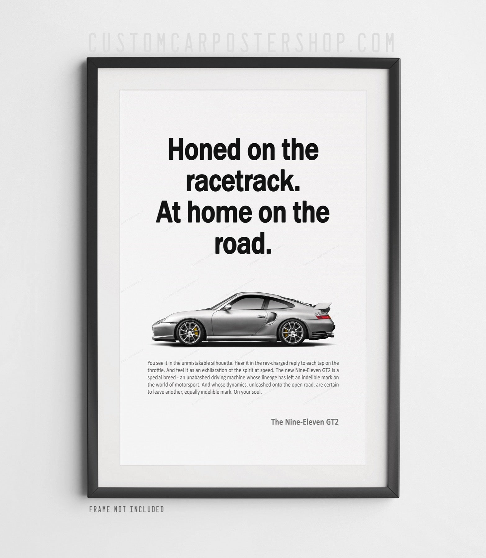 Porsche 996.2 GT2 remastered poster featuring a silver 911 GT2 with “Honed on the racetrack. At home on the road.” headline