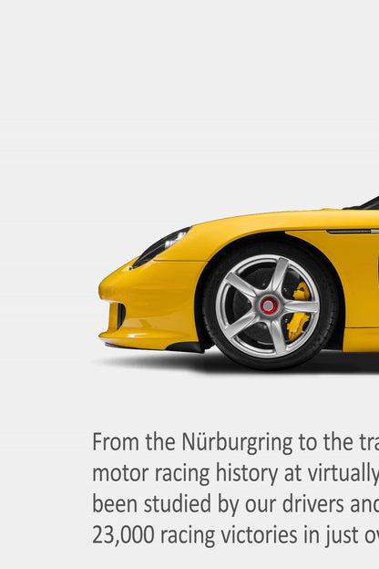 Close-up detail of the Porsche Carrera GT print ad showing the yellow front end, silver wheel and body copy typography.