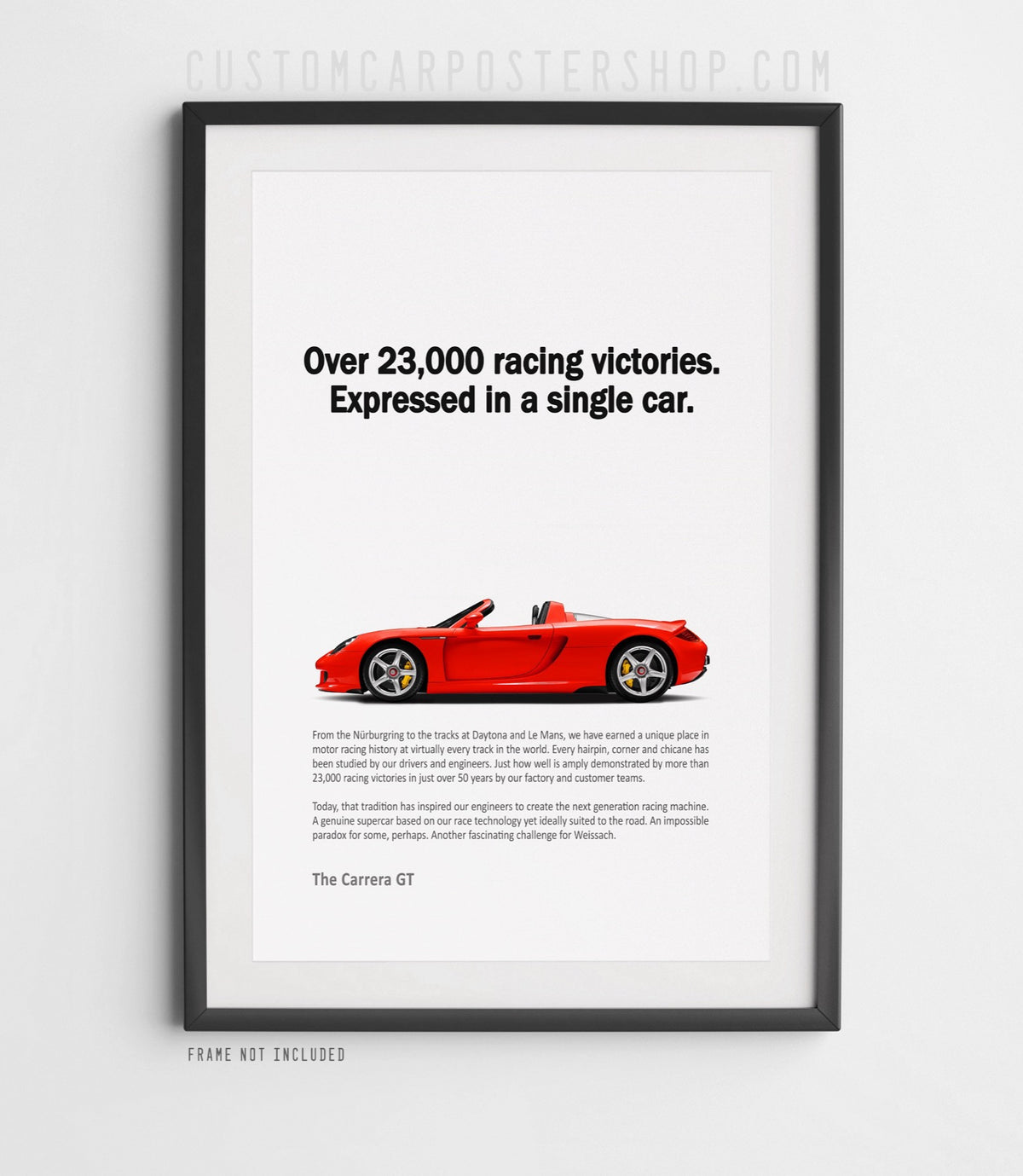 Remastered Porsche Carrera GT “Over 23,000 racing victories” print ad poster featuring a red open-top supercar in side profile.