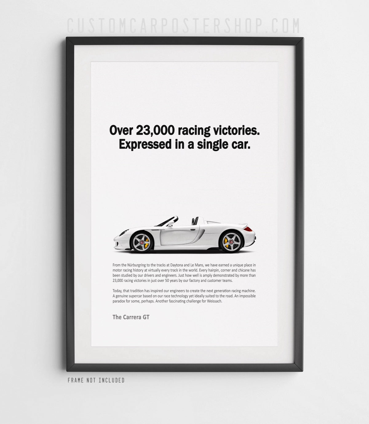 Remastered Porsche Carrera GT “Over 23,000 racing victories” print ad poster featuring a white open-top supercar in side profile.