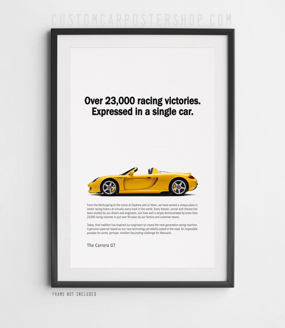 Remastered Porsche Carrera GT “Over 23,000 racing victories” print ad poster featuring a yellow open-top supercar in side profile.