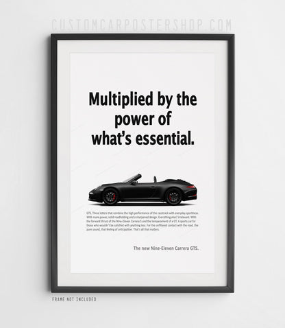 Black Porsche 911 Carrera GTS Cabriolet in side view on the remastered ‘Power of What’s Essential’ advertisement poster.